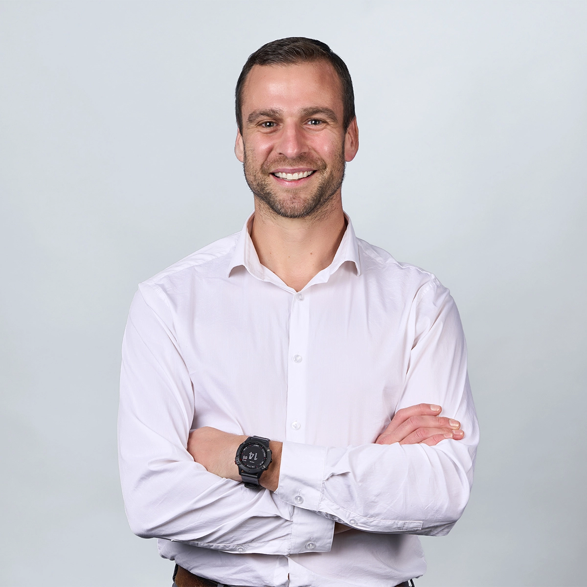 Picture of Andre LeFort in a white dress shirt with crossed arms.
